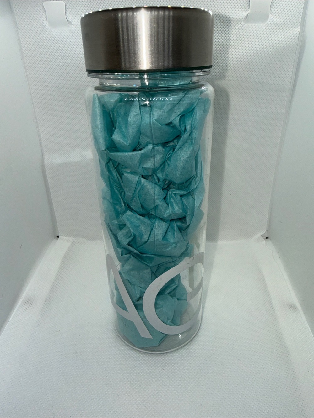 AG1 Plastic Water Bottle with Stainless Steel Cap - Transparent